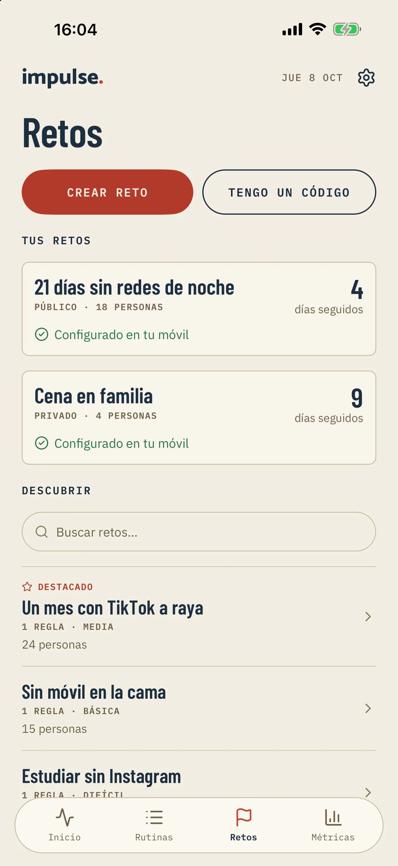 Pestaña Retos de Impulse en iPhone, con los botones Crear reto y Tengo un código y la lista de tus retos.